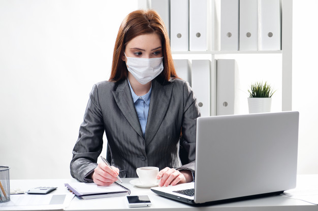 sick-businesswoman-protective-medical-mask-office_112337-1727